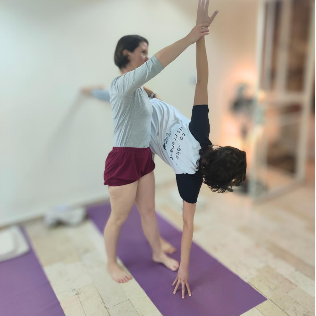 adjustment in Ardha chandrasana Iyenar yoga with Agi